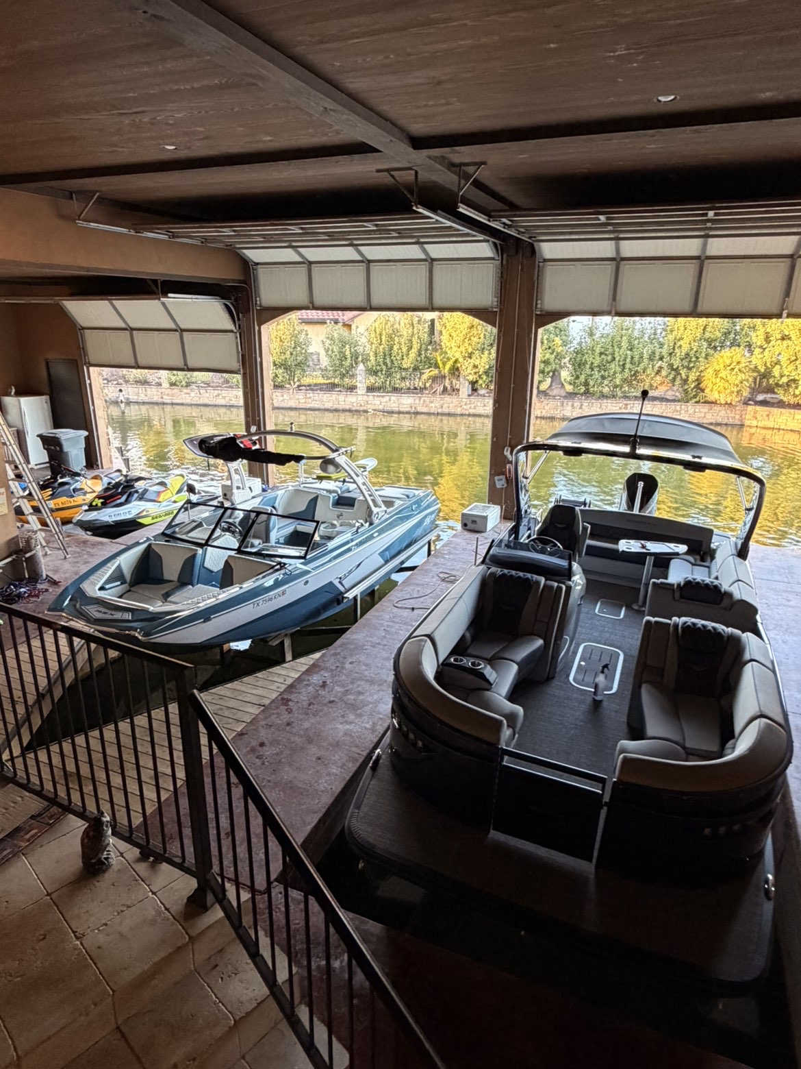 Detailed boats in waterfront garage